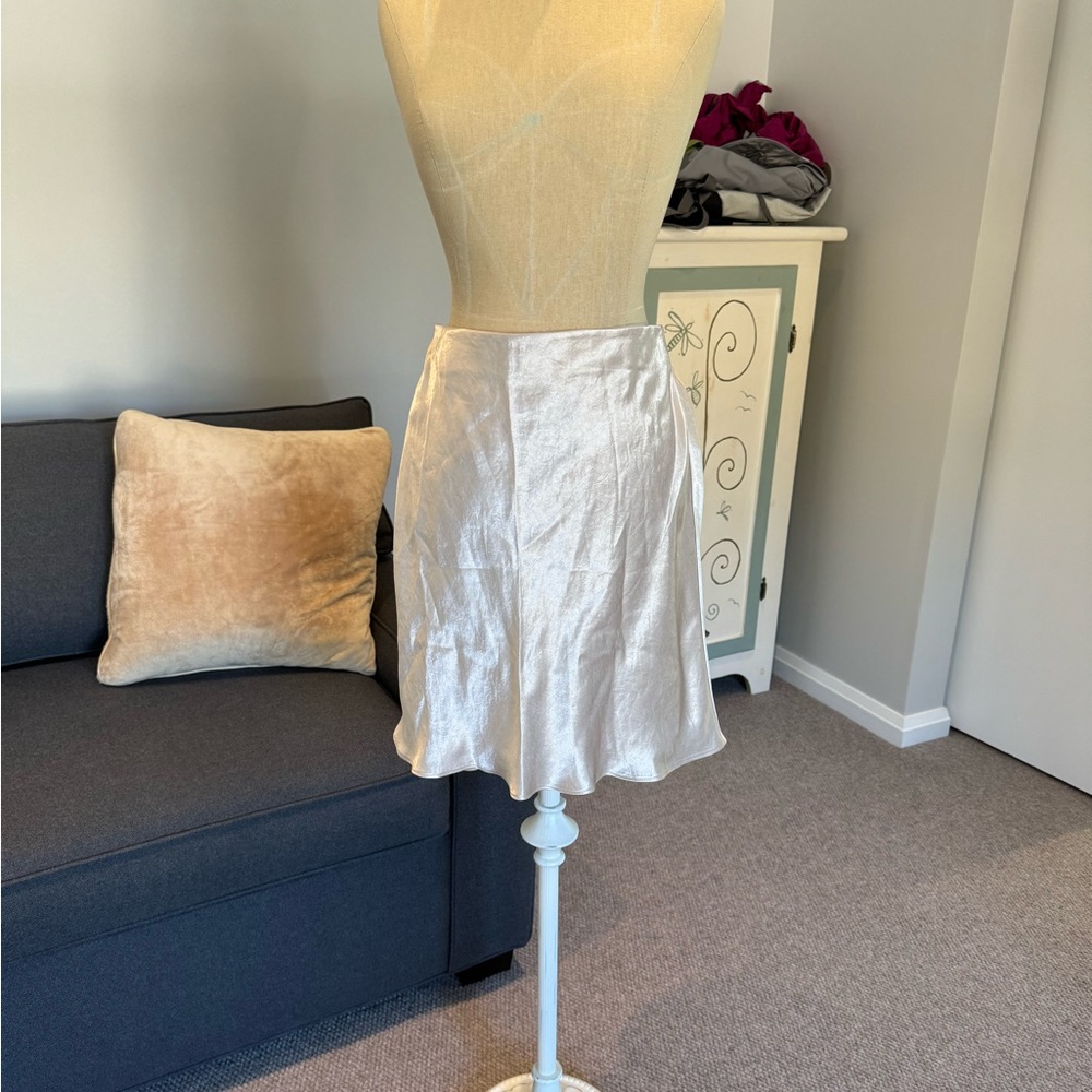 From Aritzia, Babaton silky satin skirt in a luminous pearl / winter white.